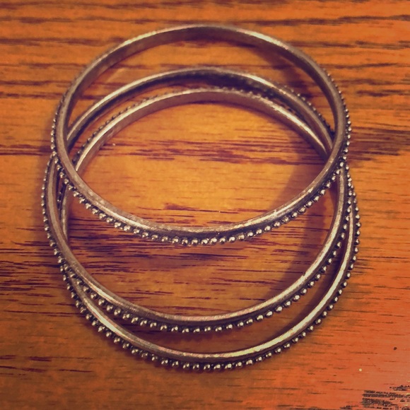 Three silver tone bangle bracelets. - Picture 1 of 1